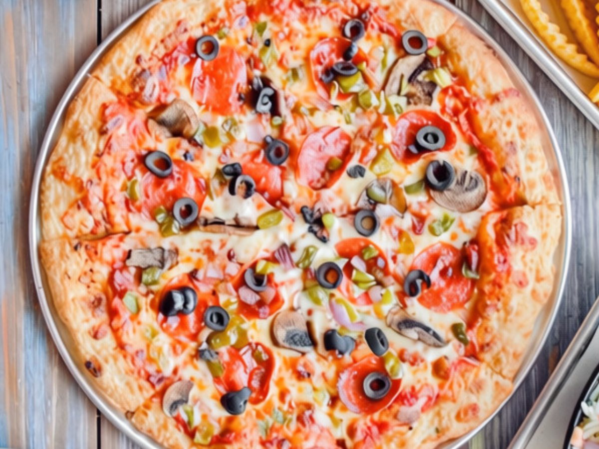 A supreme pizza topped with pepperoni, sausage, mushrooms, peppers, onions and black olives