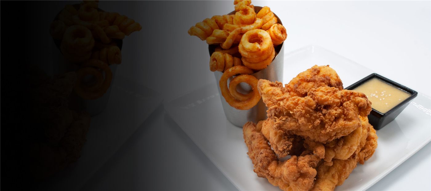 A platter of chicken tenders and onion rings from the GameTime kitchen