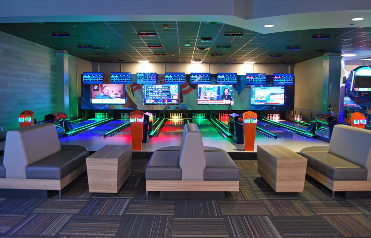 A wider view of the Ocoee mini bowling lanes and the screens above them